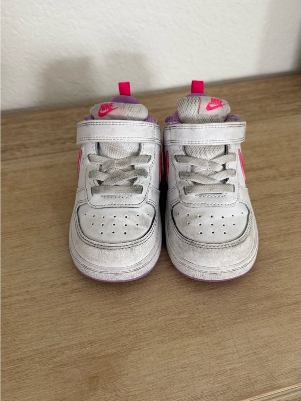 Nike Toddler White Sneakers with Pink Swoosh
